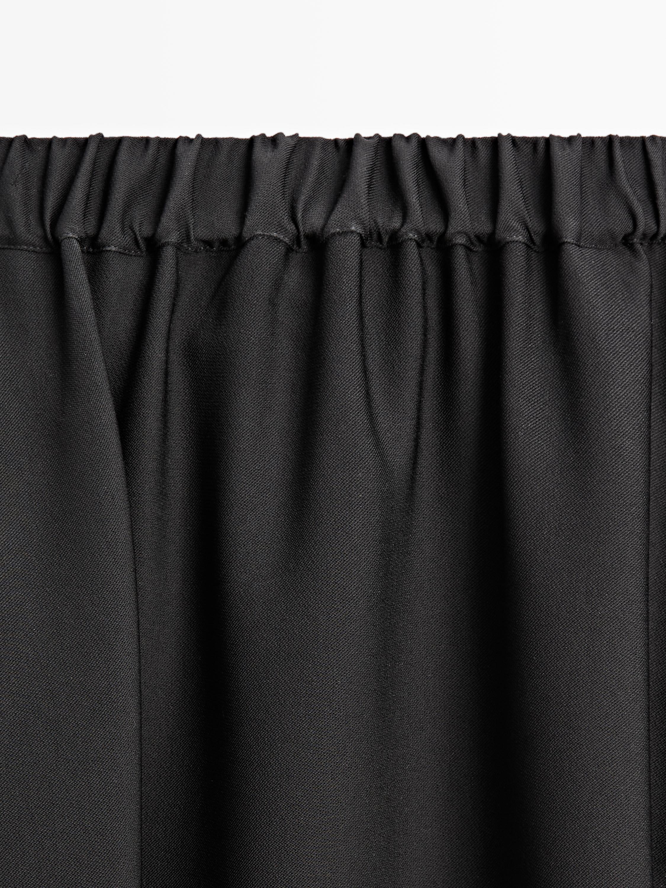 Jupe midi évasée à taille élastique